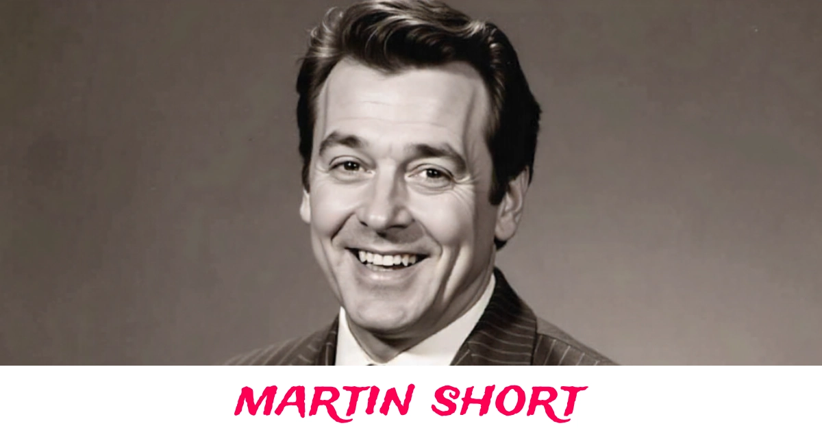 Martin Short smiling at a red carpet event in elegant black suit