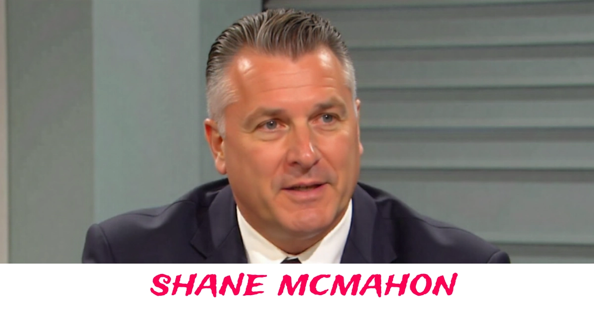 Shane McMahon standing in WWE arena during live wrestling event