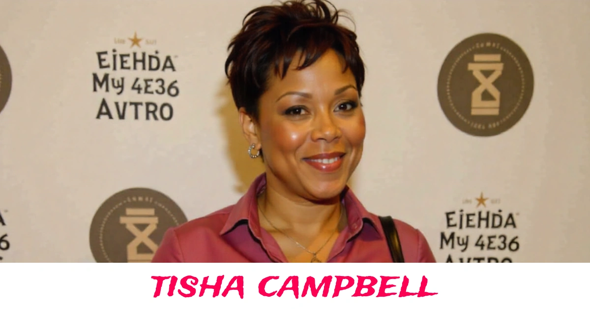 Tisha Campbell smiling at red carpet event